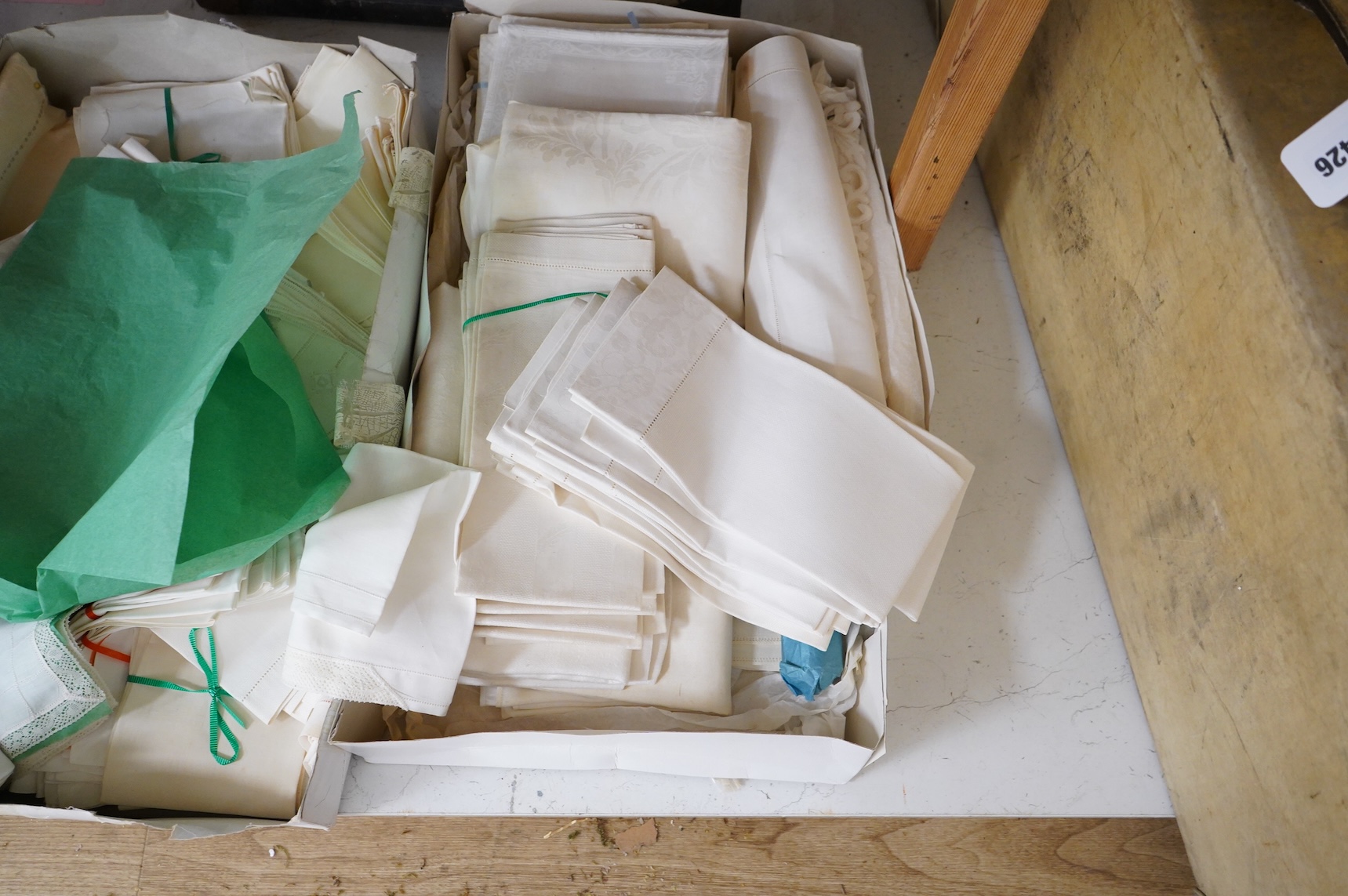 A collection of mixed damask embroidered and cutworked table cloths, napkin sets, hand towels and mats (in 3 boxes)